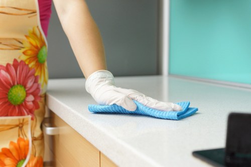 Technician treating mattress stains during mattress cleaning in SE8