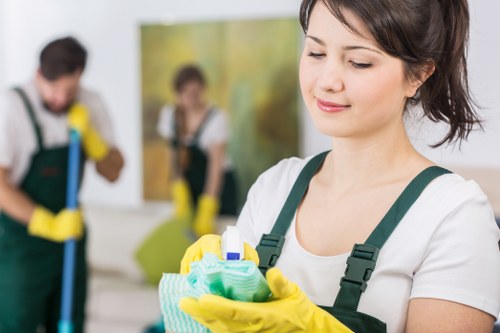 Cleaner preparing a living room for a house clean in SE8